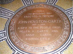 bronze dedication seal on entry floor